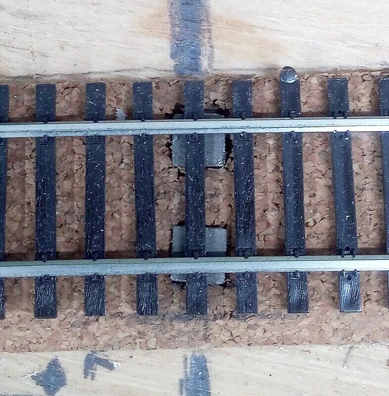 Magnetic uncoupler under new track