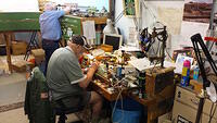IC&UT&MC the late John Holland at his work bench Unicorn operator in back 
